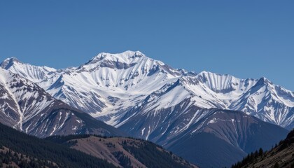 Panoramic View of Snow-Capped Mountains under Clear Blue Sky in Remote Wilderness