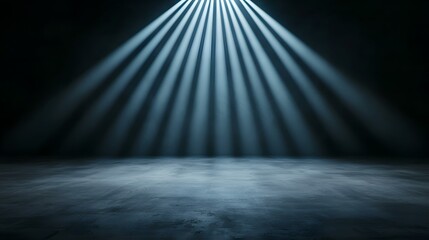 Obraz premium A dark, moody scene is set with a textured concrete floor illuminated by a single, bright light source above, casting dramatic, ray-like beams of light downwards.