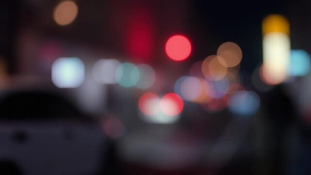Soft blurred colorful light up Bokeh sign board along building in city nightlife