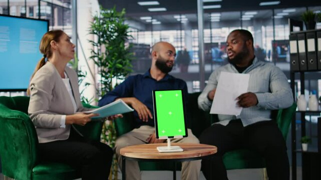 Confident CEOs group planning business development with isolated screen, analyzing performance and implementing decisions through structured analysis and leadership skills. Camera A.