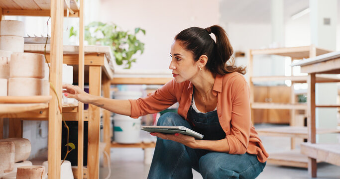 Pottery, shelf and woman in workshop on tablet for inventory, planning and checklist of ceramic designs. Creative business, art studio and person on digital tech for diy hobby, handicraft and website