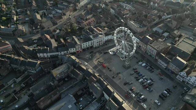 Explore the charming streets of Ripon featuring a delightful Ferris wheel and picturesque townscape