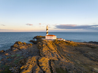 Faro de Favaritx al atardecer en la Isla de Menorca, Baleares