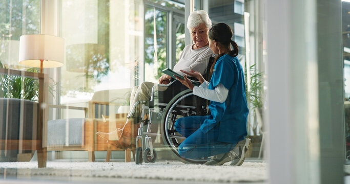 Women, nurse and mature patient in wheelchair at retirement home for healthcare, support and checkup. Caregiver, person with disability and tablet for medical service, physiotherapy and discussion