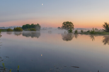 The wonderful lake was breathing fog