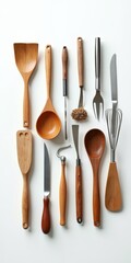 Assorted wooden kitchen tools on white background