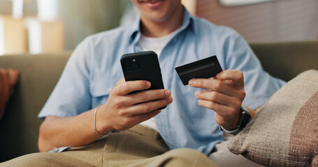 Man, hands and phone with credit card for online shopping, ecommerce and payment portal in home....