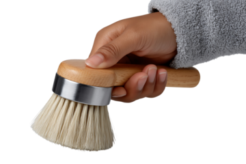 Hand holding round wooden brush, white isolate background