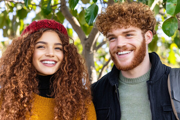 Joyful moments shared by friends laughing together amidst nature during a sunny afternoon