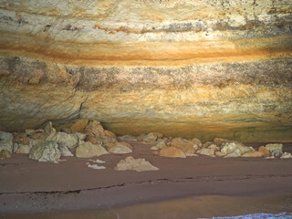 Coastline of the Algarve coast in Portugal with tall cliffs, hidden grottoes and idyllic bays