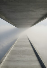 Abstract concrete pathway through fog