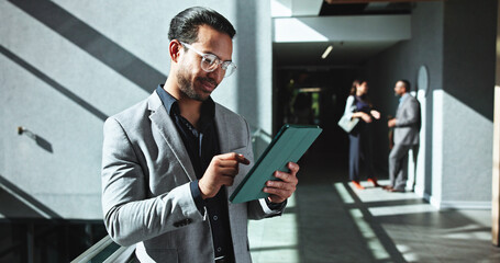 Businessman, research and browsing with tablet at office building for company report or review....