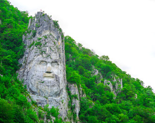 Decebal head statue in Romania on white background