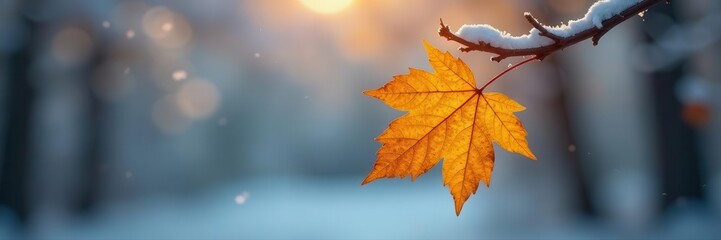 Fototapeta premium Last golden leaf on stark winter branch, soft focus backdrop , winter landscape, seasonal