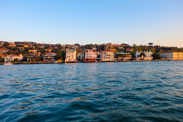 Obraz premium Bosphorus cruise along the sea in Istanbul, beautiful sunset with view of Asian and Europe side 