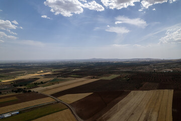 Aerial View of Olive Groves and Agricultural Fields in Kilis, Turkey with Mountains and Clouds