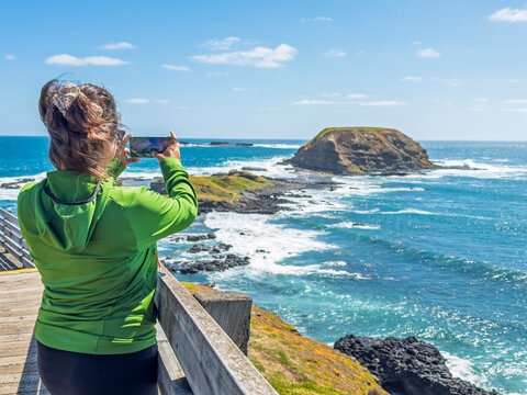 Woman Captures Coastal View by the Ocean in Phillip Island