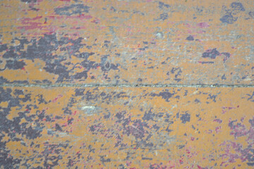 texture of the wooden surface with peeling brown and red paint