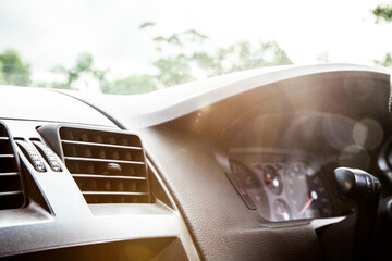 Sun flare over dashboard and speedo of car