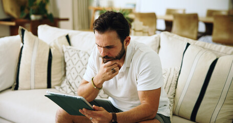 Home, thinking and man on sofa, tablet and internet with online reading, mistake and email....