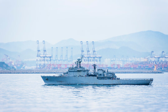 A South Korean navy frigate in grey camouflage returns to base after a coastal patrol mission near the port of Busan &ndash; a quiet moment after completing its maritime duty.