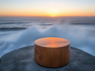 Naklejka premium Wooden cylinder sculpture on a coastal rock formation at sunset.