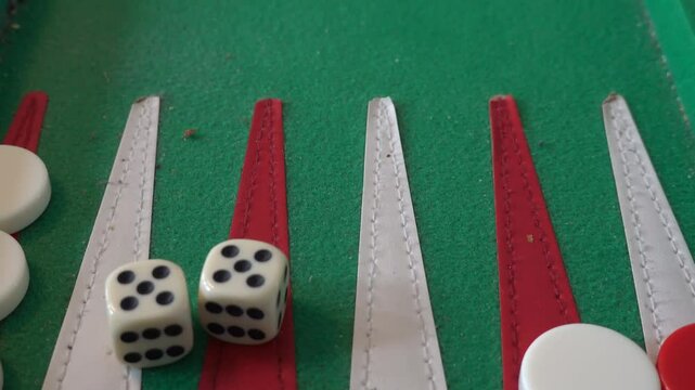 Stockholm, Sweden Two players play backgammon with dice on a backgammon board. 