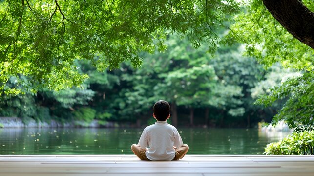 Boy Meditating by Lake