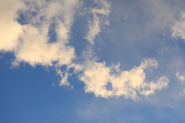 the clouds and blue sky in the sunset