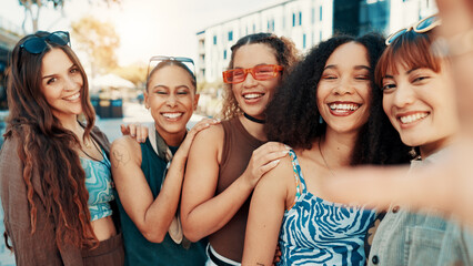 Obraz premium Girl, selfie and smile with group in city, portrait or bonding with streetwear for fashion in summer. Gen z women, friends and happy with photography, memory or trendy style for social media in town