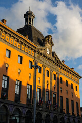 Colorful facade of the town hall of Aurillac at sunset