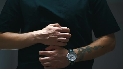 A man in a black T-shirt experiences abdominal discomfort.
Food poisoning and stomach cramps.
Intestinal infection in a man.
Pain, infection, abdomen, stomach, gastrointestinal specialist