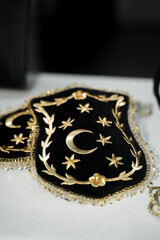 golden jewelry on white with turkish flag on it