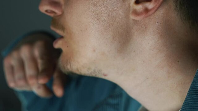 A man touches his lips with his hands.
The topic of lies.
A person doesn't trust someone.
The man is balking.
Chegovek brynchik on the lips with his hand