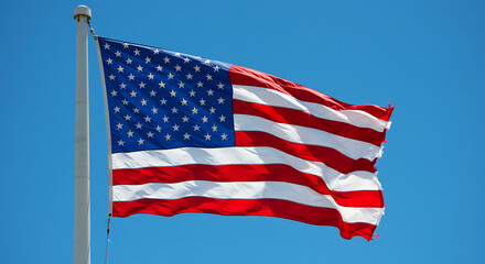 Fototapeta premium Waving American Flag with Fifty Stars and Thirteen Stripes on a Pole