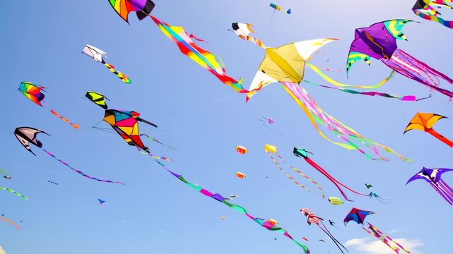 Colorful Kites Flying in a Bright Blue Sky