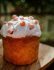 Photo of traditional Easter bread known as paska, soft and slightly sweet, topped with white glaze and colorful sprinkles. Baked to celebrate the Easter on the spring