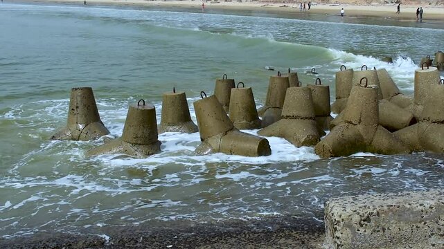 This beautiful scenic video depicts the attractive Shankarpur beach in the Bay of Bengal near Digha, India, where several Tetrapod breakwaters, a type of structure in coastal engineering, can be seen.