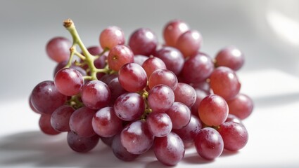 Fototapeta premium Ripe Red Globe Grapes Bunch with Stems and Leaves, Closeup Macro Food Photography