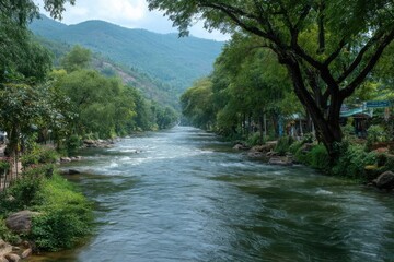 Scenic River Landscape Photography: Tranquil Mountain Stream Surrounded by Lush Green Trees and Vegetation, Serene Atmosphere, Cool Tone