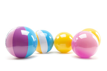 Colorful beach balls arranged playfully on a white background, evoking summer fun and leisure activities