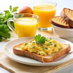 Scrambled eggs on toast with orange juice