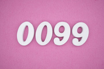 The numbers are made of white painted wood, placed on a pink paper background.