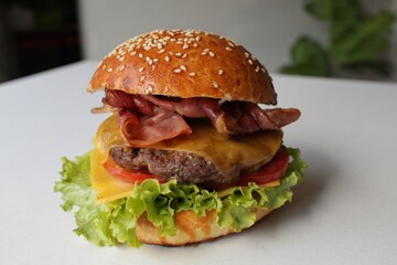 Artisan Burger with Cheddar, Lettuce, and Crispy Bacon – Side View