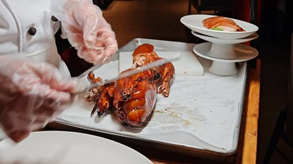 A chef expertly carves roast Peking duck at a bustling dining event in Shanghai, showcasing culinary skills and flavors.