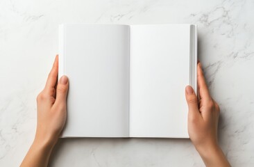 Open blank notebook held with two hands on white background