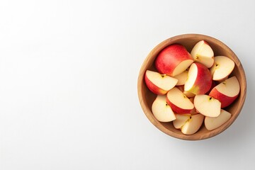 Freshly cut red apples in a wooden bowl on white background