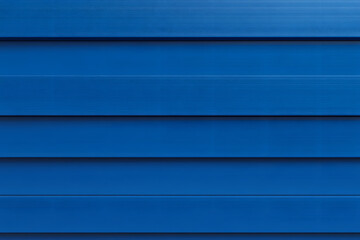 Fototapeta premium Simple, horizontal bands of vibrant, slightly textured blue