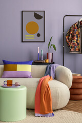 Interior desgin of modern living room interior with mock up poster frame, colorful decorations and accessories, plants, sofa, coffee table. Blue wall. Home decor. Template..