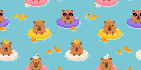 Cute minimalistic vector cartoon background with relaxed capybara swimming on an inflatable ring with rubber ducks. Fun summer seamless pattern